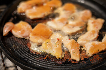 Chicken strips sizzling in a pan Dinner is almost ready