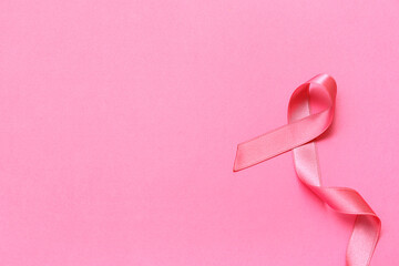 Silk ribbon on pink background. Breast cancer concept