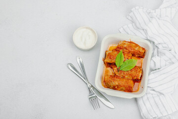 Cabbage rolls stuffed with rice and meat stewed in tomato sauce. Traditional dish, ready-to-eat food