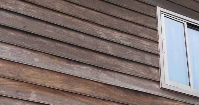 Old house wall, wooden house wall in the countryside