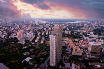 Obraz premium Sunset in megalopolis. Beautiful cityscape with top view on skyscrapers. Bangkok, Thailand.