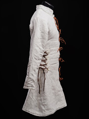 Historical fashion. Medieval knight cloth. Padded jacket gambeson.