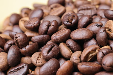 Dark brown Coffee bean flow move fall drop pan smoking roasting on jute fabric background