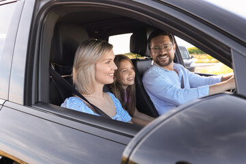 Fototapeta premium Happy family enjoying trip together by car, view from outside