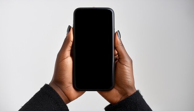 Tel&eacute;fono celular negro manos de mujer