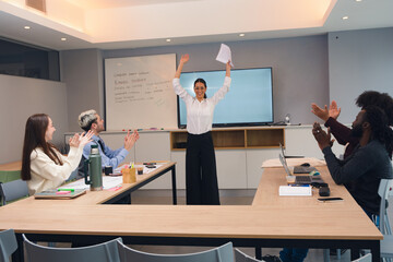 Happy businesswoman speaker finishes presentation