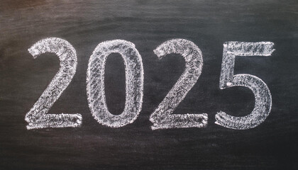 2025 written in chalk on chalkboard. Ideal for educational and academic projects. New Year.