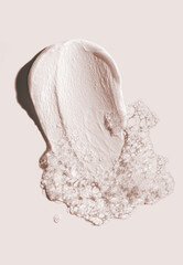 Cosmetic smudge swatch face foam cleanser on beige background