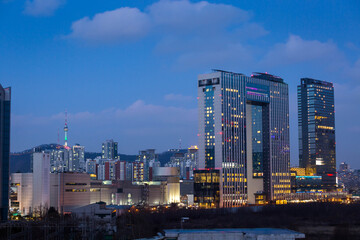 Cityscape of Seoul at night and Skyscraper at Yongsan District with Namsan Mountain in the background, Seoul, South Korea.