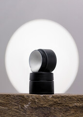 gel nail polish in a black jar on a beautiful background