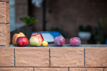 Fresh fruits lying on the windowsill of the gazebo