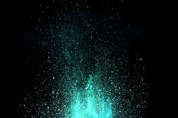 Abstract green powder dust particles explosion on black background. Powders dust splash, Paint Holi, Freeze motion of color dust exploding