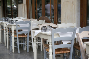 Empty seats in sidewalk caf