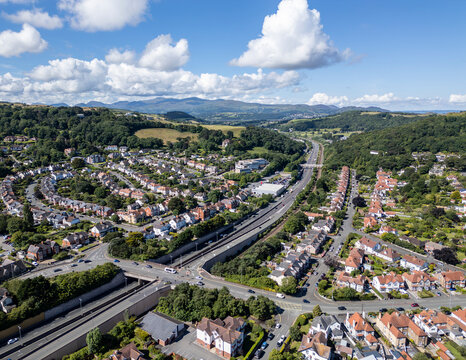 A55 expressway road, houses and gardens in Colwyn Bay, North Wales seaside resort, Great Britain