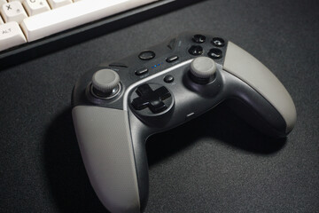 Modern pc keyboard and game pad on table © AriaSandi