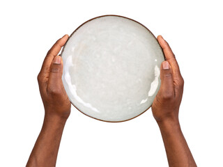Human hands holding an empty plate isolated on white or transparent background, top view
