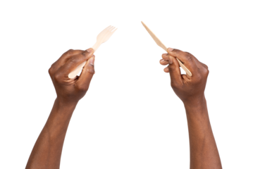 Man holding disposable wooden fork and knife, isolated on white or transparent background