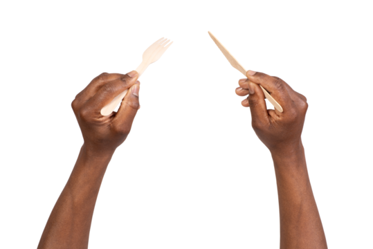 Man holding disposable wooden fork and knife, isolated on white or transparent background