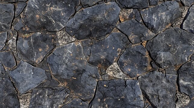 Dark stone mosaic pattern with interlocking irregular shapes