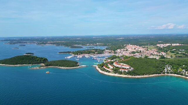 An aerial view of Vrsar, featuring Porto Sole Beach and Maistra Camping Porto Sole in Croatia, captured by a drone. This picturesque coastal area showcases the beautiful  with crystal water