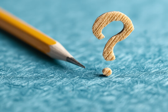 Artwork creatively illustrates a Question Mark using colorful pencils set against a vibrant blue chalkboard background - Powered by Adobe