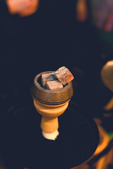 Colorful hookah on bokeh background close up