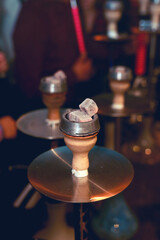 Colorful hookah on bokeh background close up