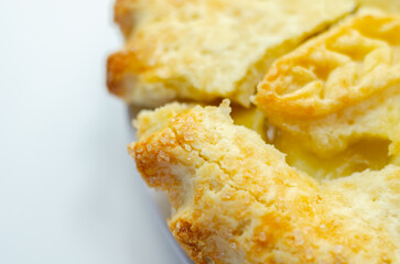 A apple pie with a leaf design on top