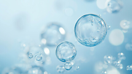 Floating bubbles in clear blue water with a soft, light background.
