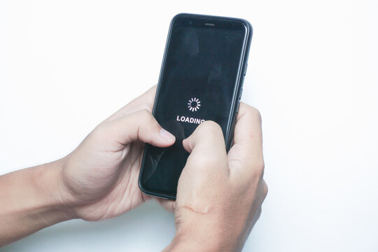 System error, slow loading, no connection to wifi on mobile smartphone screen in man hand. No signal internet connection on cellphone. System software update and upgrade loading process.