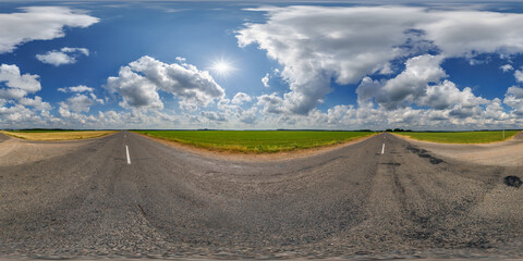 spherical 360 hdri panorama on asphalt T-shaped road intersection with clouds and sun on blue sky...