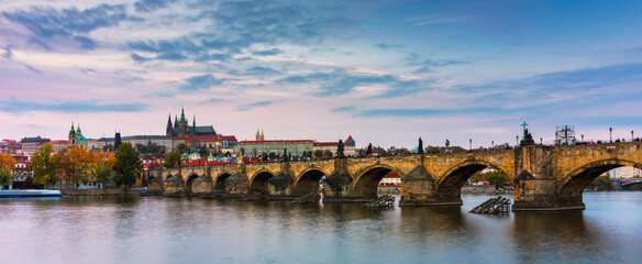 Charles Bridge in Prague in Czechia. Prague, Czech Republic. Charles Bridge (Karluv Most) and Old Town Tower. Vltava River and Charles Bridge. Concept of world travel, sightseeing and tourism.