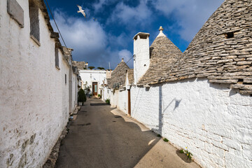 The traditional Trulli houses in Alberobello city, Apulia, Italy. Cityscape over the traditional roofs of the Trulli, original and old houses of this region, Apulia, Alberobello, Puglia, Italy.