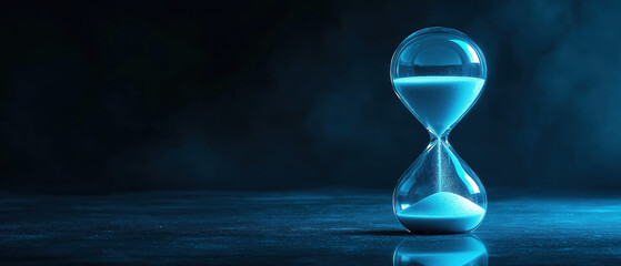 A mesmerizing hourglass filled with sand, glowing in a blue ambiance, symbolizing the passage of time and serenity.