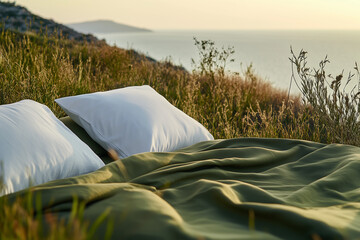 A bed with olive sheets amidst a green meadow. Concept of healthy sleep in the fresh air, quality and natural bedding.  Bed advertisement. 