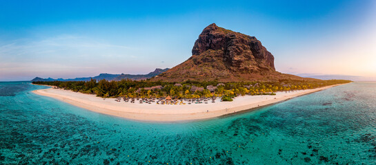 Aerial view of Le morne Brabant in Mauriutius. Tropical crystal ocean with Le Morne mountain and luxury beach in Mauritius. Le Morne beach with palm trees, white sand and luxury resorts, Mauritius.
