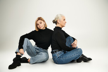 Two women share a moment of connection and style in a modern setting.