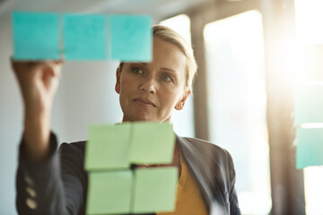 Planning, sticky notes and window with business woman in office for brainstorming or development....