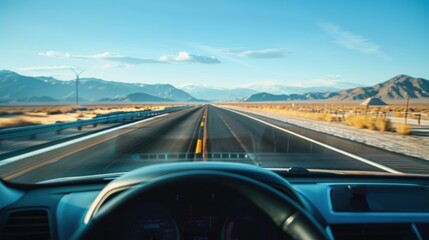 Driving on a Desert Road with Mountains in the Distance