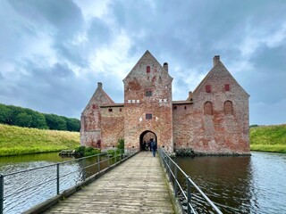 Spøttrup Castle built of red brick, is an ancient building surrounded by beautiful scenery in Central Jutland, Denmark. © Iulliart