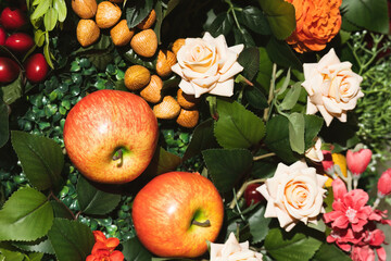Fruity, floral arrangement still life. Vivid summer colours of fruit and flowers