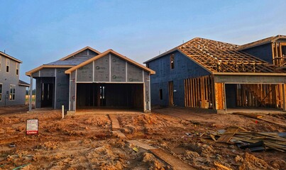 This is a picture of a house, that is currently under construction, in a new neighborhood, in Houston, Texas.