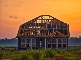 This is a picture of a house, that is currently under construction, in a new neighborhood, in Houston, Texas.