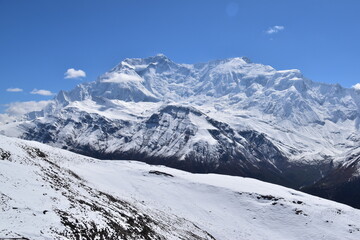 Fototapeta premium Kicho Tal, the Ice Lake and surrounding glaciers and mountains as seen while hiking the Annapurna Circuit Trek in Nepal, Himalaya