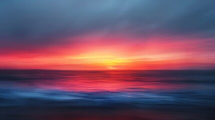 Fototapeta premium A stunning sunset creating vibrant hues of orange and purple over tranquil ocean waves, reflecting beauty and serenity.