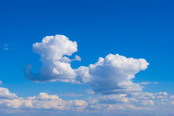 cumulus clouds on blue sky background