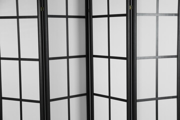 One folding screen as background, closeup view