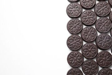 Tasty sandwich cookies on white background, top view. Space for text