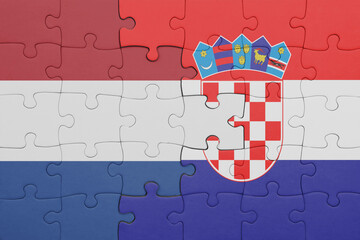 puzzle with the colourful national flag of croatia and flag of netherlands.