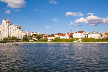 Fototapeta premium Minsk, Belarus - August 01, 2024: View of the Svislach River and Trinity Suburb